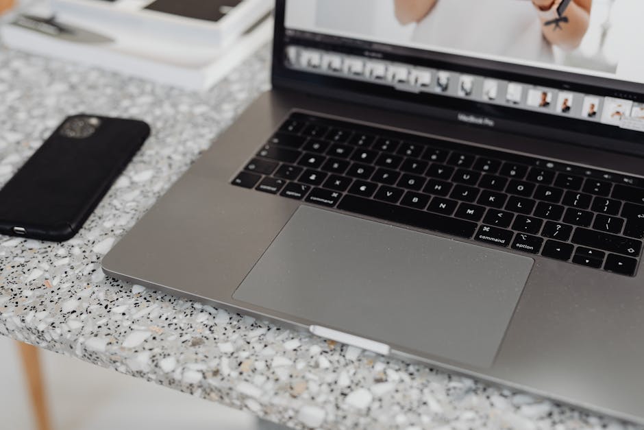 Smartphone and laptop arranged on a clean workspace