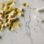 Vitamins and supplements arranged on a clean counter